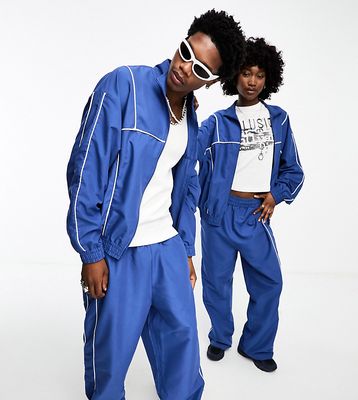 COLLUSION Unisex track pants in blue - part of a set