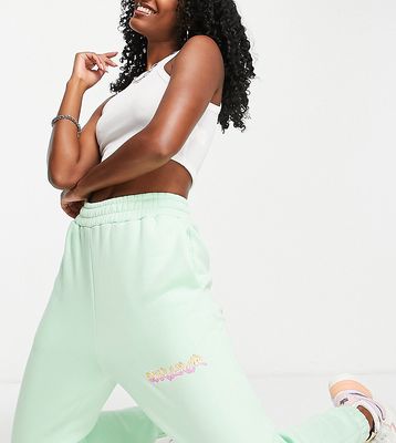 COLLUSION warped branded sweatpants in light green