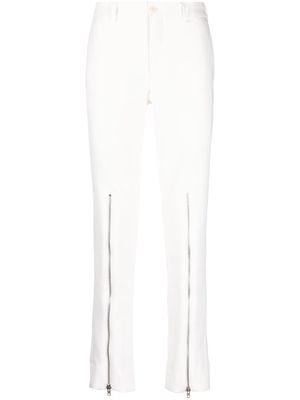 Comme Des Garçons Homme Plus decorative zip-detailing low-rise trousers - White