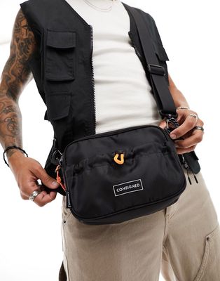Consigned front pocket cross-body bag in black