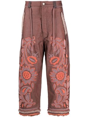 Craig Green floral-embroidered cropped trousers - Orange