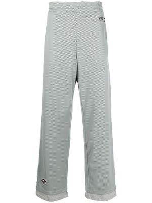 Diesel logo-patch perforated pants - Green