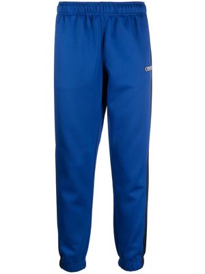 Diesel logo-patch tapered track pants - Blue