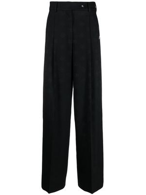 Dolce & Gabbana all-over logo print trousers - Black
