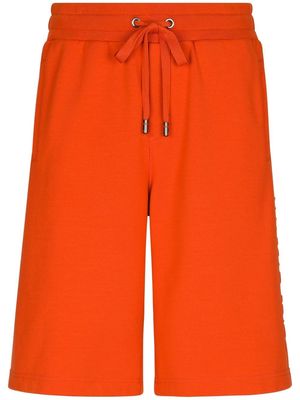 Dolce & Gabbana embossed-logo jersey track shorts - Orange