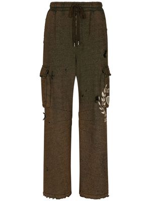 Dolce & Gabbana graphic-print ripped track pants - Brown