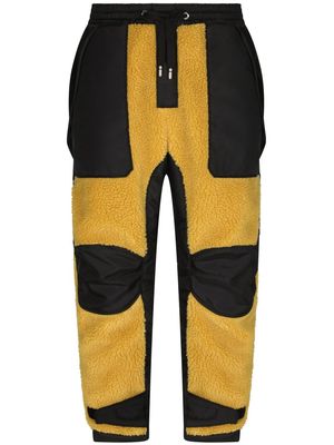 Dolce & Gabbana panelled-design track pants - Yellow
