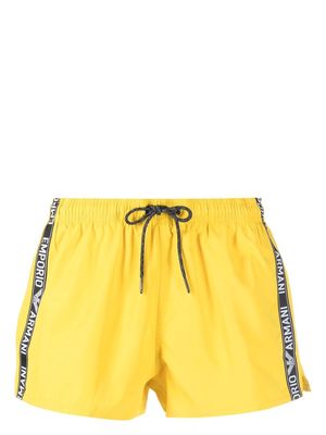 Emporio Armani logo-stripe swim shorts - Yellow