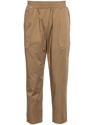 Family First pleat-detail tapered trousers - Neutrals