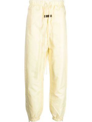 FEAR OF GOD ESSENTIALS logo-patch track pants - Yellow