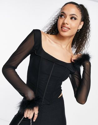 Femme Luxe faux feather trim corset top in black