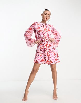 Flounce London shift mini dress with bell sleeves in mixed heart print-Pink