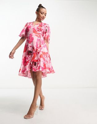 Flounce London wrap front mini dress with flutter sleeves in pink rose print