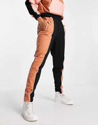 Fred Perry color block sweatpants in black and orange - part of a set