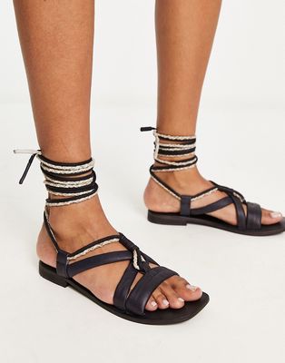 Free People leather wrap sandal in black and cream
