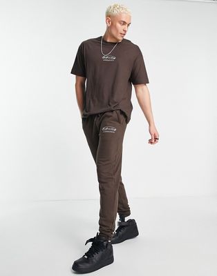 Good For Nothing relaxed jersey sweatpants in brown with emblem chest and back print - part of a set