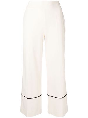 GOODIOUS cropped piped-hem trousers - White