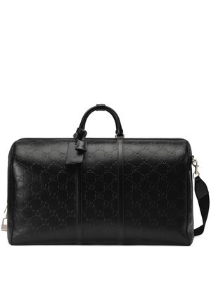 Gucci GG embossed leather duffle bag - Black
