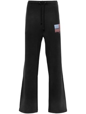 GUESS USA logo-print flared track pants - Black