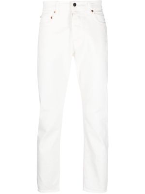 Haikure logo-patch denim trousers - White