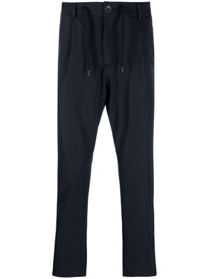 Herno logo-plaque button-fastening tapered trousers - Blue