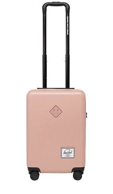 Herschel Supply Co. Heritage Hardshell Carry On in Pink.