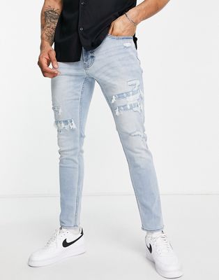 Hollister skinny fit distressed repair jeans in light wash-Blue