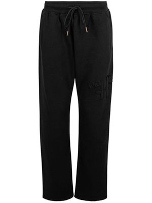 Honor The Gift script-embroidered cotton track pants - Black