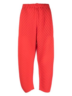 Issey Miyake plissé-effect straight-leg trousers - Red