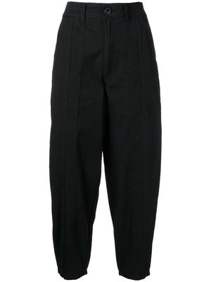 izzue exposed-seam tapered trousers - Black