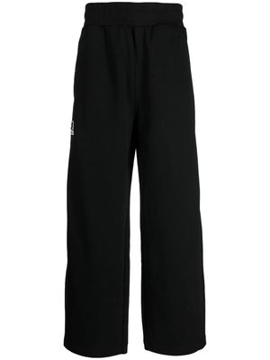 izzue logo-appliqué wide-leg trousers - Black