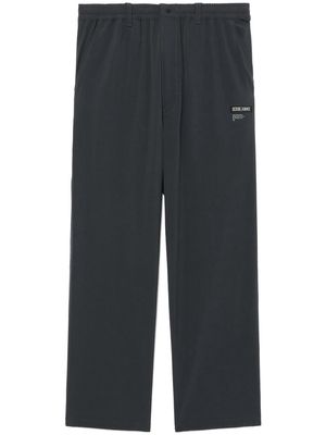 izzue logo-appliquéd trousers - Grey