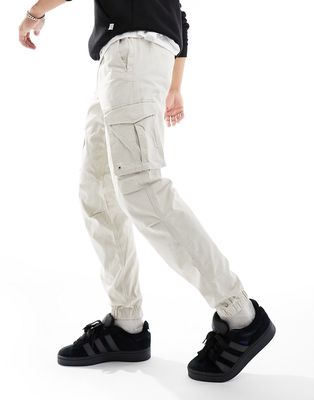 Jack & Jones tapered cuffed cargo pants in off-white