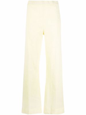 Jil Sander crepe-texture flared trousers - Yellow