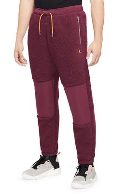 Jordan Essential Fleece Pants in Cherrywood Red