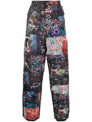 Khrisjoy all-over graphic-print trousers - Black