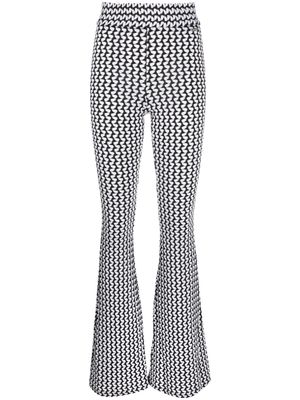 Koché geometric-print flared trousers - Black