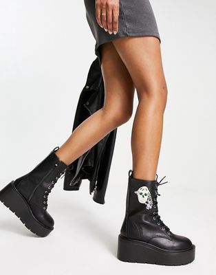Koi Footwear skull lace up platform boots in black