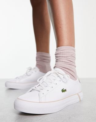 Lacoste Gripshot sneakers in white/pink