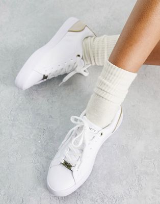 Lacoste Lerond lace up sneakers with gold detailing in white leather