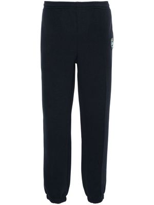 Lacoste logo-patch piqué-weave trousers - Blue
