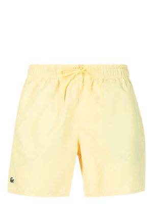 Lacoste logo-patch swim shorts - Yellow
