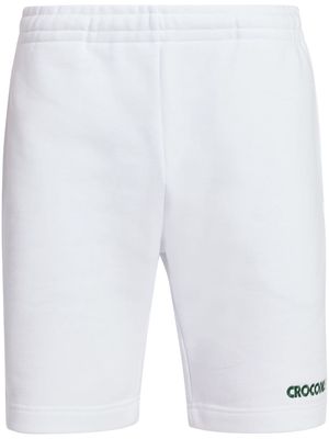 Lacoste slogan-embroidered cotton track shorts - White