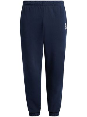Lacoste slogan-embroidered elasticated track pants - Blue