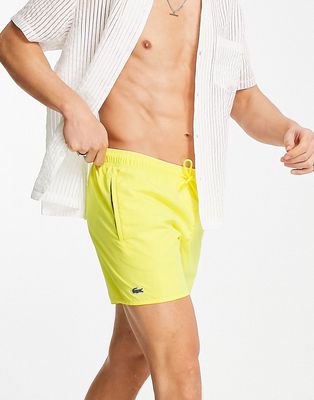 Lacoste small logo swim shorts in yellow