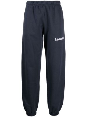 Late Checkout logo-embroidered cotton track pants - Blue