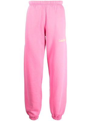 Late Checkout logo-embroidered cotton track pants - Pink
