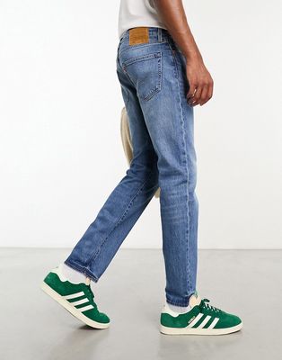 Levi's 502 taper jeans in mid blue wash