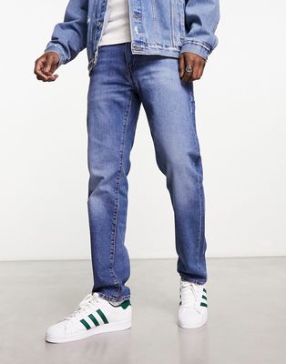 Levi's 502 taper jeans in midwash blue