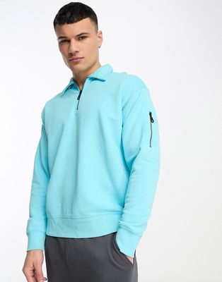 Levi's Skate half zip sweatshirt in light blue with small logo